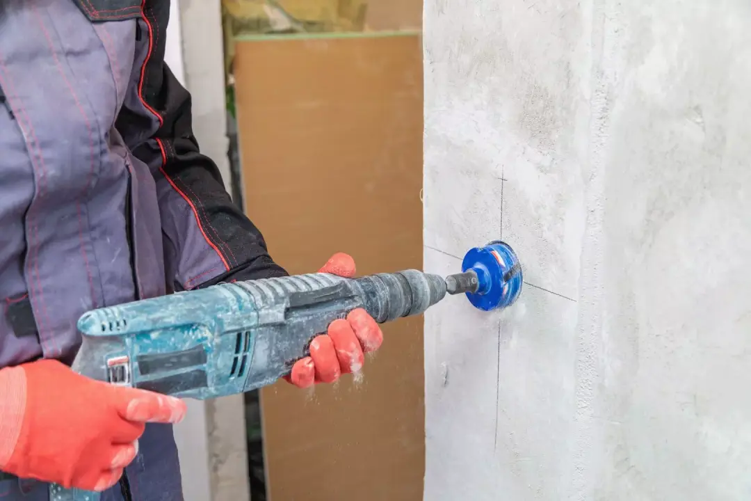 Drilling a wall opening for an electrical accessory
